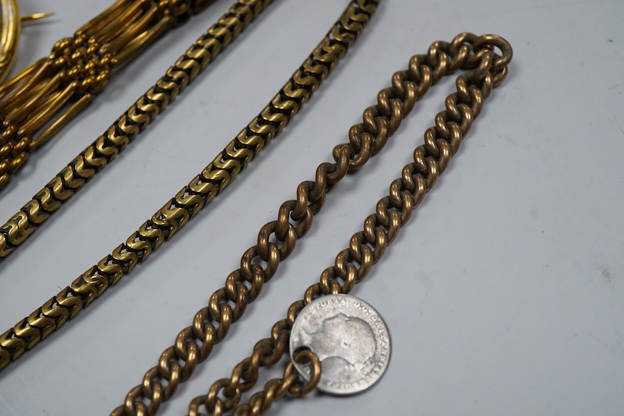 A group of gilt metal/pinchbeck jewels, 19th and early 20th century, comprising: a brooch of knotted design; two gate bracelets; a fancy link bracelet; an open-faced pocket watch; two oval panel brooches, and two watch c